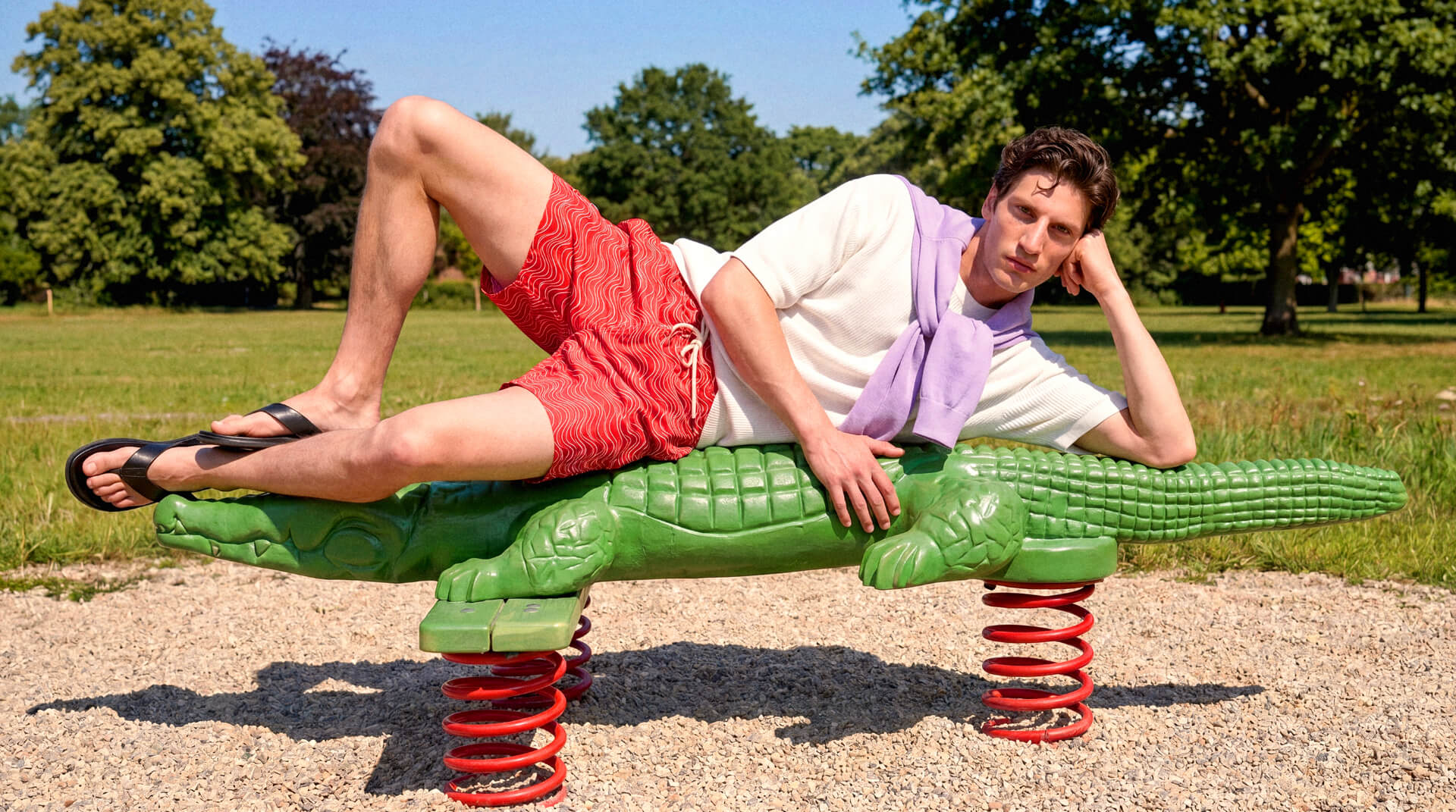 Model wearing Sheep Inc. knitwear in a sunlit landscape